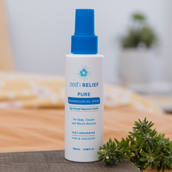 Zea Magnesium Oil Topical Spray on a bedside table